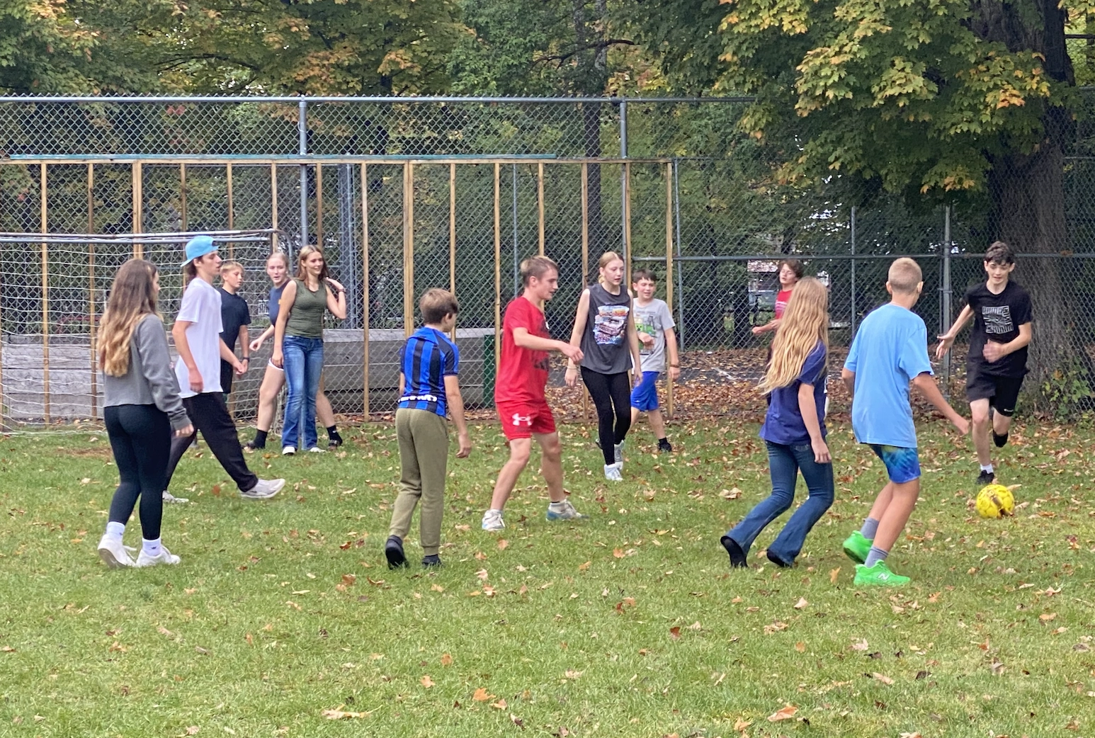 teens playing soccer